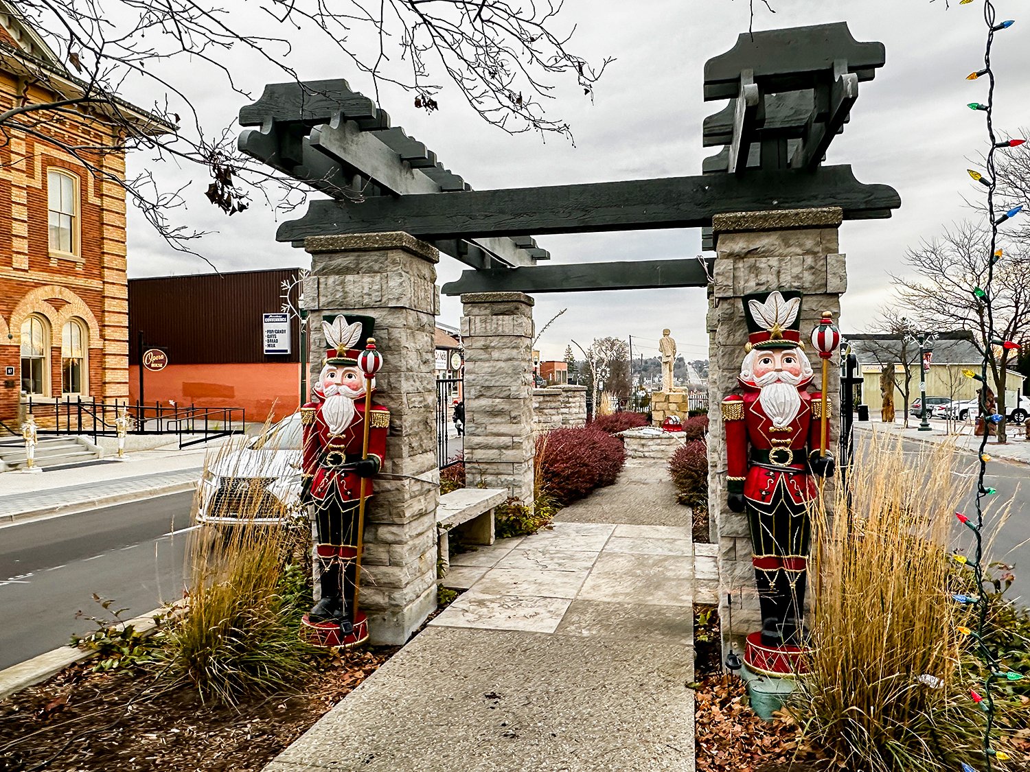 Nutcracker's on a median in front of a pergola